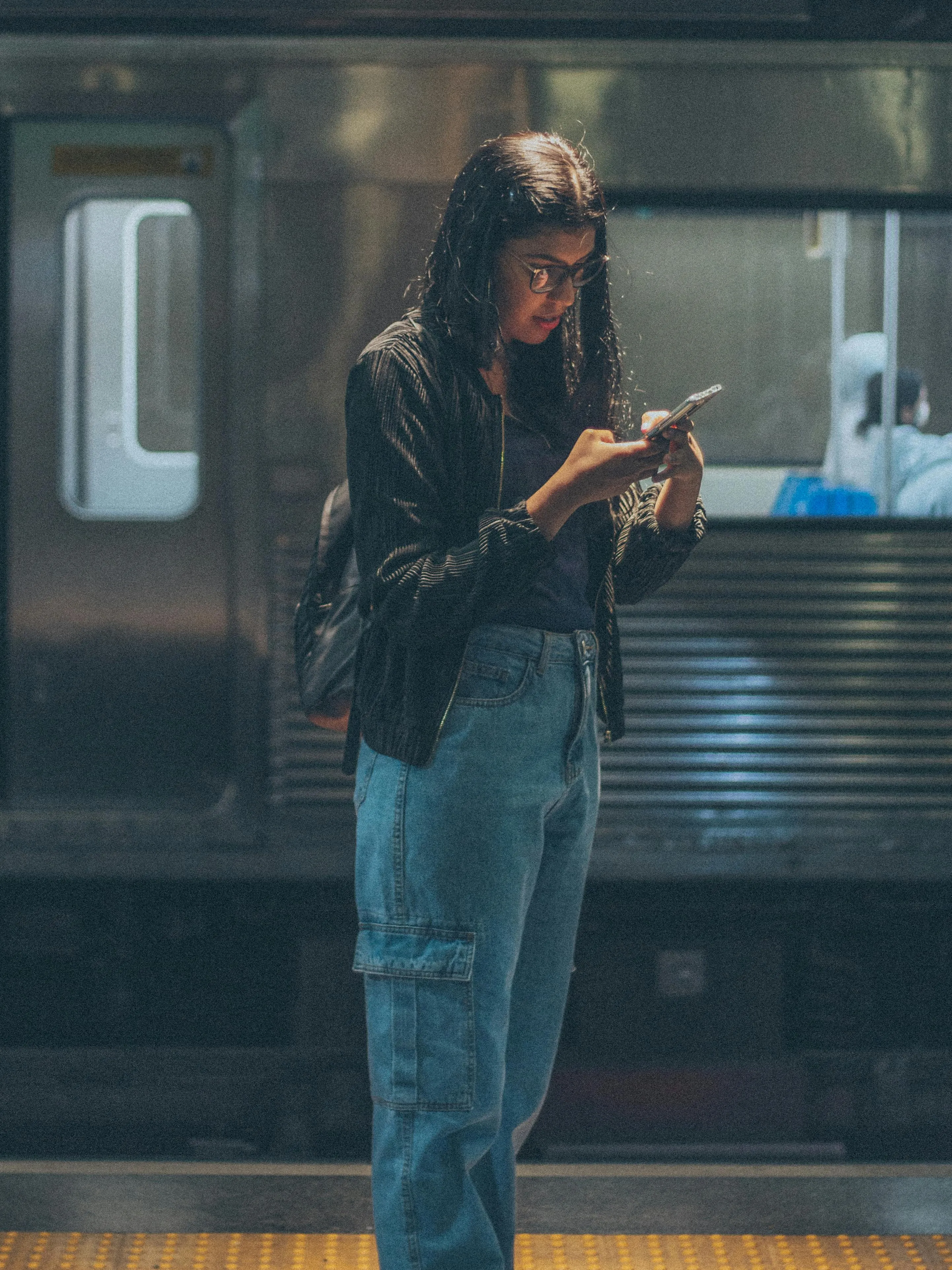 Picture of a girl using her phone for depicting use of social media